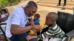 DR. BORKETEY SPENDING TIME WITH SPECIAL CHILDREN