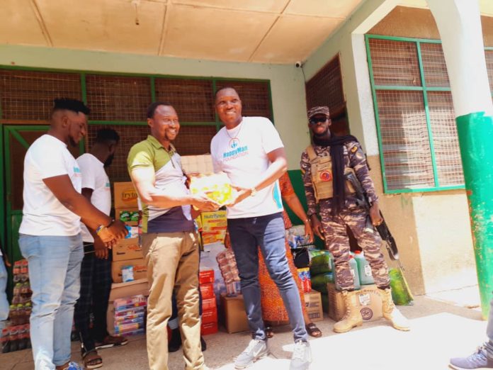 DR BORKETEY HANDING OVER ITEMS TO CHILDREN'S HOME