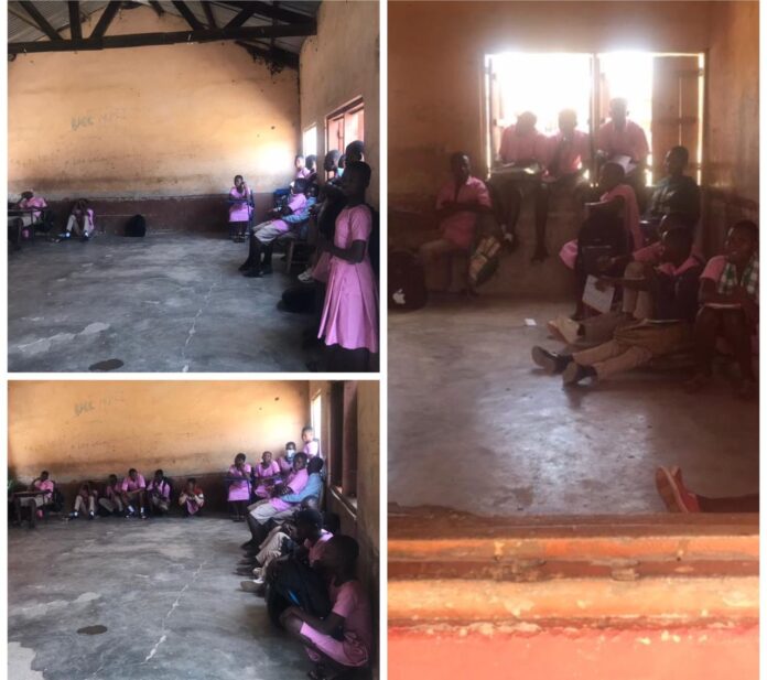 Some of the students standing, others squatting after a lesson