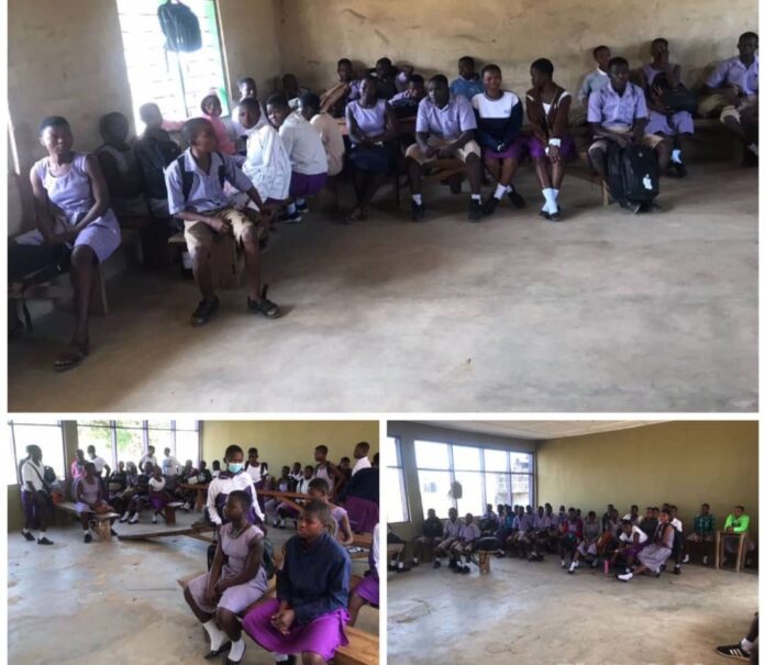 First-year students of Zuarungu SHS sit on benches for lessons