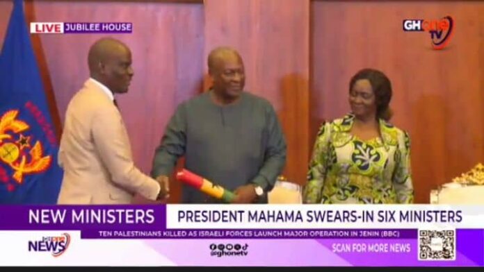 John Dramani Mahama hands instrument of office to Minister of Education Haruna Iddrisu